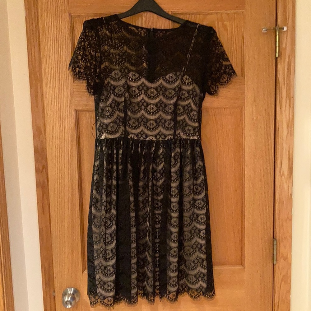 Black lace cocktail dress with nude underlay